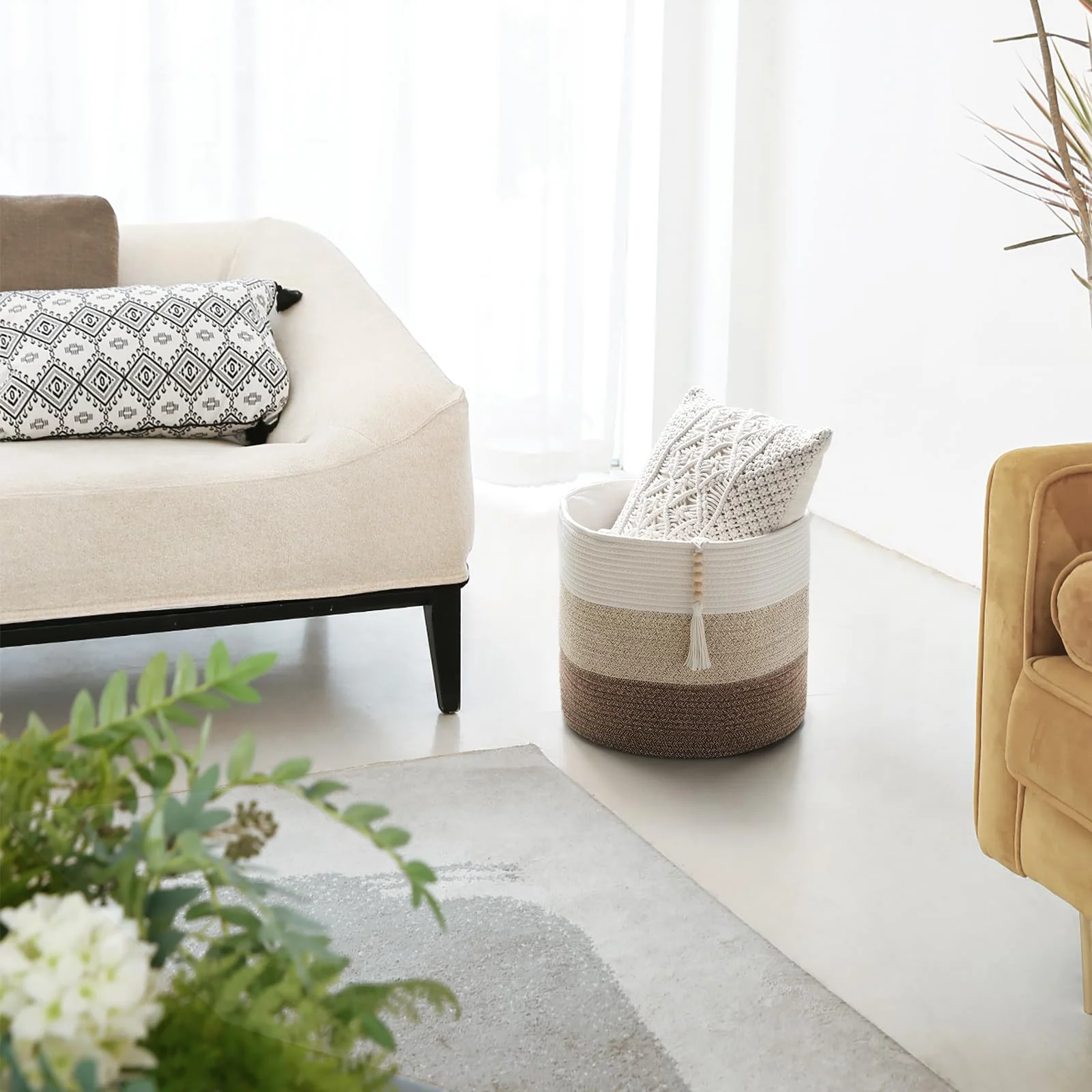 The same basket, folded down, next to a sofa