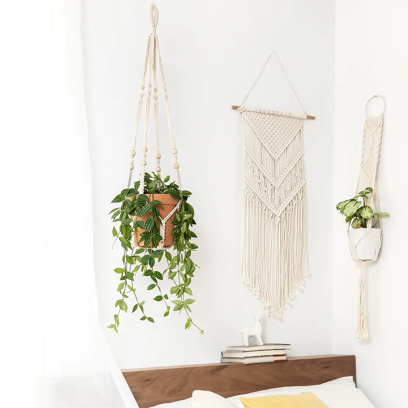 A 35-inch hanger and a woven wall piece over a bed