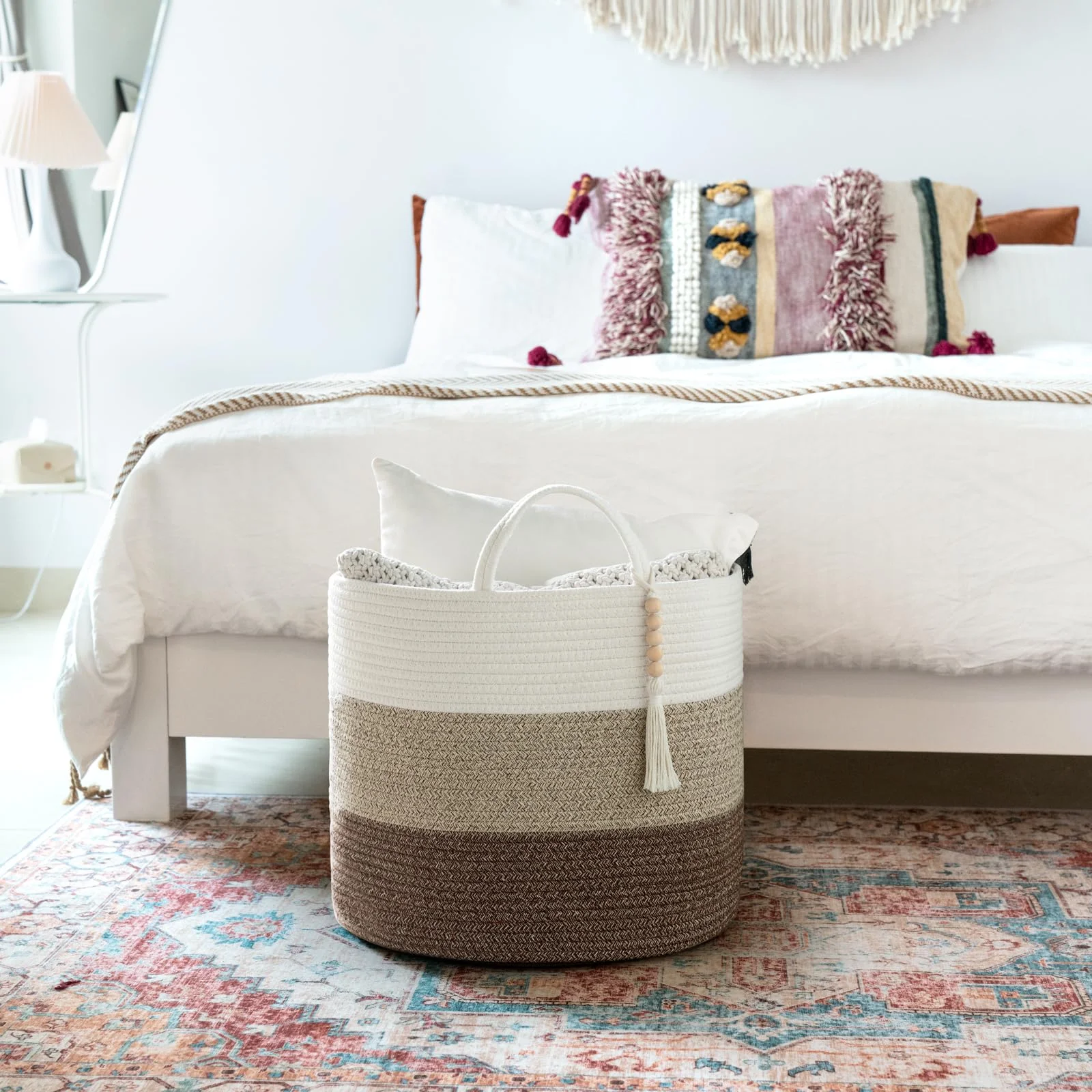 A 16-inch cotton rope basket beside a bed